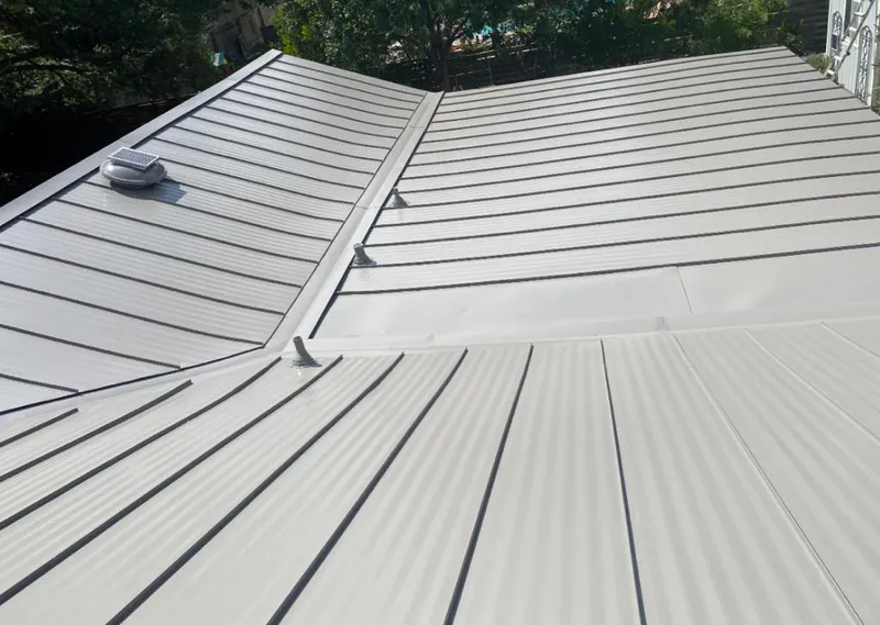 Solar attic fan installed on a metal roof for Roof Ventilation in Summit Park